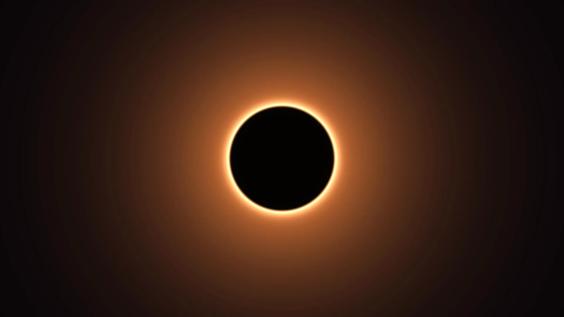 Black sun with a ring of amber light — solar eclipse wallpaper at 3840x2160