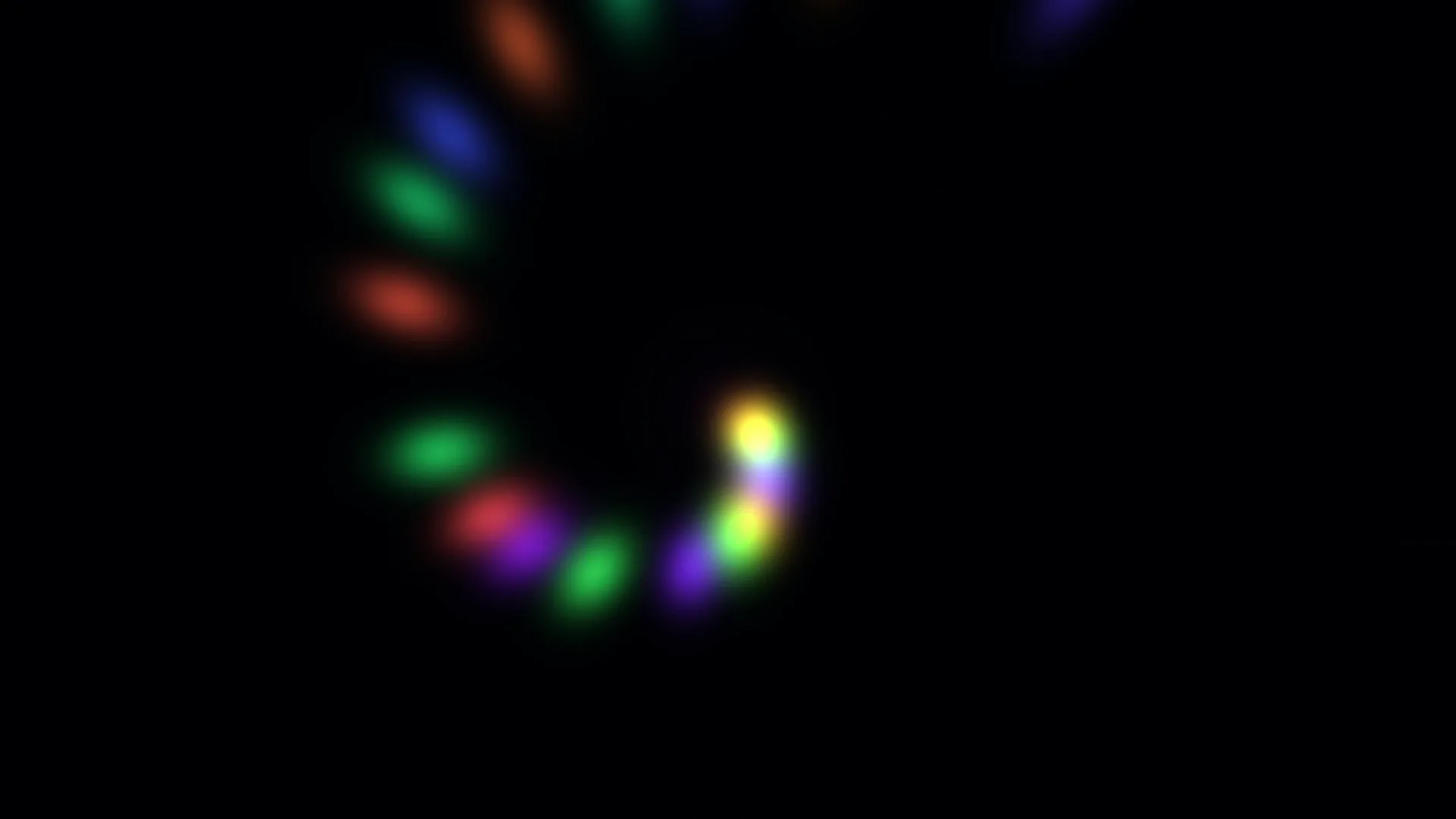 Blurred spectrum lights across a black field — abstract wallpaper at 3840x2160