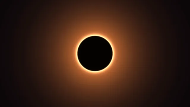 Black sun with a ring of amber light — solar eclipse wallpaper at 3840x2160