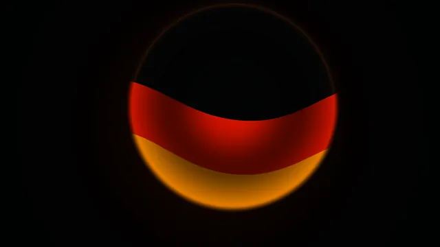 Red and amber eclipse over a black field — eclipse wallpaper at 3840x2160
